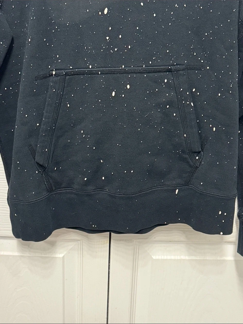 Nike Black Pullover Hoodie with White Swoosh and Paint Speckle